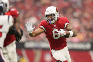 Running back James Conner #6 of the Arizona Cardinals rushes the football against the Houston Texans during the NFL game at State Farm Stadium on October 24, 2021 in Glendale, Arizona. The Cardinals defeated the Texans 31-5.