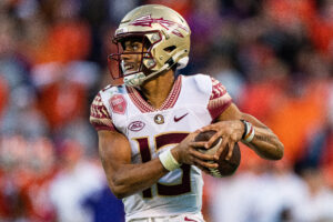 Quarterback Jordan Travis #13 of the Florida State Seminoles runs with the ball against the Clemson Tigers during their game at Clemson Memorial Stadium on October 30, 2021 in Clemson, South Carolina.