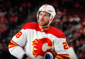 Elias Lindholm #28 of the Calgary Flames skates against the New Jersey Devils at the Prudential Center on October 26, 2021 in Newark, New Jersey. 