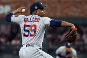 Framber Valdez #59 of the Houston Astros delivers the pitch against the Atlanta Braves during the first inning in Game Five of the World Series at Truist Park on October 31, 2021 in Atlanta, Georgia.