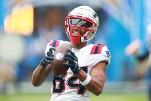 Kendrick Bourne #84 of the New England Patriots smiles with the ball prior to the start of the game against the Los Angeles Chargers at SoFi Stadium on October 31, 2021 in Inglewood, California. 