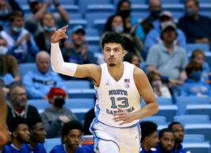 Dawson Garcia #13 of the North Carolina Tar Heels reacts after a three-point basket against the Elizabeth City State Vikings during their game at the Dean E. Smith Center on November 05, 2021 in Chapel Hill, North Carolina. The Tar Heels won 83-55.