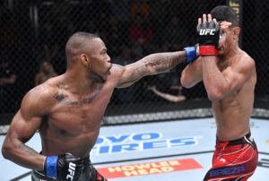 Khaos Williams (left) lands a left-hand straight punch to the face of Miguel Baeza (right) in a welterweight fight during the UFC Fight Night