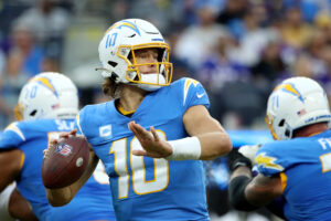 Justin Herbert #10 of the Los Angeles Chargers looks to pass the ball during the third quarter against the Minnesota Vikings at SoFi Stadium on November 14, 2021 in Inglewood, California.