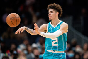 Charlotte Hornets guard LaMelo Ball passes the ball against the Golden State Warriors during their game at Spectrum Center on November 14, 2021 in Charlotte, North Carolina.