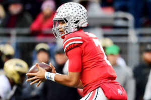 C.J. Stroud #7 of the Ohio State Buckeyes catches the snap during the first half of a game against the Purdue Boilermakers at Ohio Stadium on November 13, 2021 in Columbus, Ohio