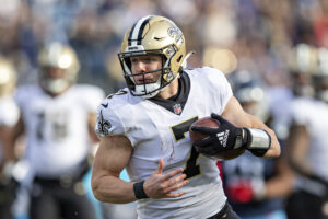 Taysom Hill #7 of the New Orleans Saints runs the ball during a game against the Tennessee Titans at Nissan Stadium on November 14, 2021 in Nashville, Tennessee. The Titans defeated the Saints 23-21.