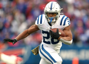 Jonathan Taylor #28 of the Indianapolis Colts runs the ball in the game against the Buffalo Bills during the first quarter at Highmark Stadium on November 21, 2021 in Orchard Park, New York.