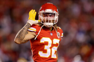 Tyrann Mathieu #32 of the Kansas City Chiefs gestures to the fans after a fourth quarter interception against the Dallas Cowboys at Arrowhead Stadium on November 21, 2021 in Kansas City, Missouri.