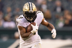 Mark Ingram #14 of the New Orleans Saints runs the ball against the Philadelphia Eagles at Lincoln Financial Field on November 21, 2021 in Philadelphia, Pennsylvania. 