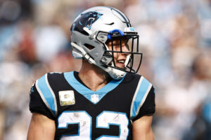 Christian McCaffrey #22 of the Carolina Panthers looks on during the first half of their game against the Washington Football Team at Bank of America Stadium on November 21, 2021 in Charlotte, North Carolina.