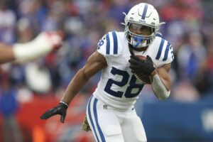 Jonathan Taylor #28 of the Indianapolis Colts rushes during the first half against the Buffalo Bills at Highmark Stadium on November 21, 2021 in Orchard Park, New York.