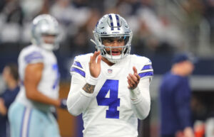 Dak Prescott #4 of the Dallas Cowboys warms up ahead of the NFL game between Las Vegas Raiders and Dallas Cowboys at AT&T Stadium on November 25, 2021 in Arlington, Texas.