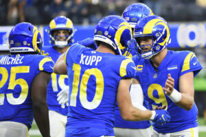 Cooper Kupp #10 of the Los Angeles Rams celebrates his touchdown with Matthew Stafford #9 of the Los Angeles Rams during the third quarter against the Jacksonville Jaguars at SoFi Stadium on December 05, 2021 in Inglewood, California.