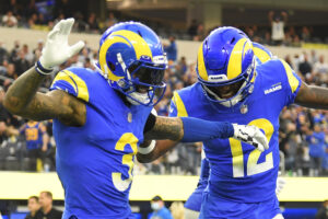 Odell Beckham Jr. #3 of the Los Angeles Rams celebrates his touchdown with Van Jefferson #12 of the Los Angeles Rams during the fourth quarter against the Jacksonville Jaguars at SoFi Stadium on December 05, 2021 in Inglewood, California.