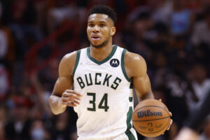 Milwaukee Bucks forward Giannis Antetokounmpo dribbles the ball upcourt against the Miami Heat