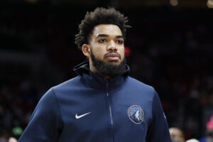  Karl-Anthony Towns # 32 of the Minnesota Timberwolves is introduced as part of the starting lineup before the game against the Portland Trail Blazers at Moda Center on December 12, 2021 in Portland, Oregon.