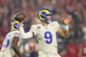 Quarterback Matthew Stafford #9 of the Los Angeles Rams throws a pass during the NFL game against the Arizona Cardinals at State Farm Stadium on December 13, 2021 in Glendale, Arizona.