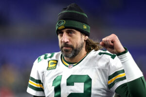 Aaron Rodgers of the Green Bay Packers celebrates as he walks off the field after their game against the Baltimore Ravens at M&T Bank Stadium on December 19, 2021 in Baltimore, Maryland.