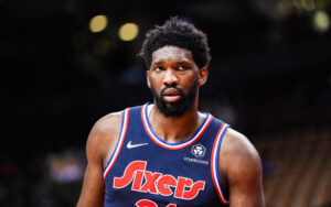 Joel Embiid #21 of the Philadelphia 76ers looks on against the Toronto Raptors during the second half of their basketball game at the Scotiabank Arena on December 28, 2021 in Toronto, Ontario, Canada.