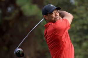 Tiger Woods plays a shot on the second hole during the final round of the PNC Championship at the Ritz Carlton Golf Club Grande Lakes on December 19, 2021 in Orlando, Florida.