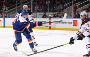 Noah Dobson #8 of the New York Islanders scores at 3:52 of overtime against the Edmonton Oilers at the UBS Arena on January 01, 2022 in Elmont, New York. The Islanders defeated the Oilers 3-2 in overtime. 