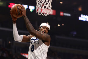 Jarred Vanderbilt #8 of the Minnesota Timberwolves grabs the rebound during the first quarter against the Los Angeles Clippers at Crypto.com Arena on January 03, 2022 in Los Angeles, California. 