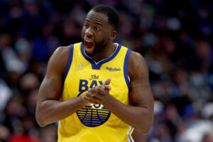 Draymond Green #23 of the Golden State Warriors reacts after being fouled by the Dallas Mavericks in the third quarter at American Airlines Center on January 05, 2022 in Dallas, Texas.