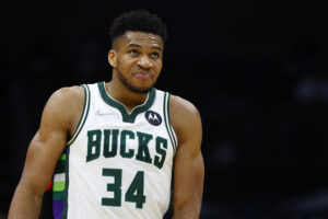 Giannis Antetokounmpo #34 of the Milwaukee Bucks reacts following a play during the second half of the game against the Charlotte Hornets at Spectrum Center on January 08, 2022 in Charlotte, North Carolina.