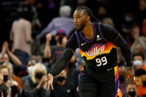 Jae Crowder #99 of the Phoenix Suns reacts to a three-point shot against the Indiana Pacers during the first half of the NBA game at Footprint Center on January 22, 2022 in Phoenix, Arizona.