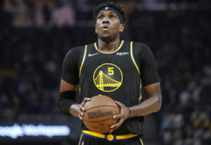 Kevon Looney #5 of the Golden State Warriors shoots a foul shot against the Utah Jazz during the first half of an NBA basketball game at Chase Center on January 23, 2022 in San Francisco, California. 