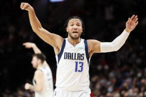 Jalen Brunson #13 of the Dallas Mavericks reacts during the third quarter against the Portland Trail Blazers at Moda Center on January 26, 2022 in Portland, Oregon.