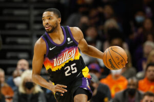 Mikal Bridges #25 of the Phoenix Suns handles the ball during the second half of the NBA game at Footprint Center on January 22, 2022 in Phoenix, Arizona.