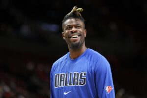 Reggie Bullock #25 of the Dallas Mavericks looks on before the game against the Portland Trail Blazers at Moda Center on January 26, 2022 in Portland, Oregon. NOTE TO USER: User expressly acknowledges and agrees that, by downloading and/or using this photograph, User is consenting to the terms and conditions of the Getty Images License Agreement.