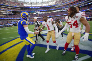 Captains of the San Francisco 49ers and the Los Angeles Rams meet at midfield for the coin toss before the game at SoFi Stadium on January 30, 2022 in Inglewood, California. The Rams defeated the 49ers 20-17.