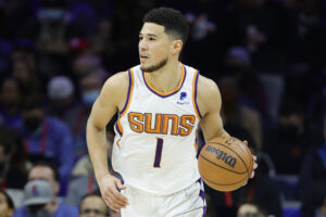 Devin Booker #1 of the Phoenix Suns dribbles against the Philadelphia 76ers at Wells Fargo Center on February 08, 2022 in Philadelphia, Pennsylvania.