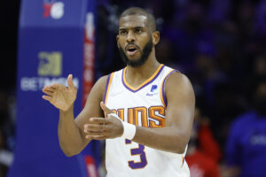 Chris Paul #3 of the Phoenix Suns callsto teammates against the Philadelphia 76ers at Wells Fargo Center on February 08, 2022 in Philadelphia, Pennsylvania.