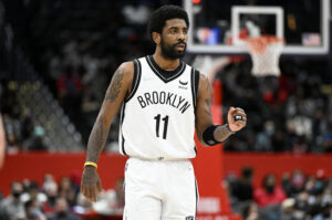 Kyrie Irving #11 of the Brooklyn Nets gestures during the second quarter against the Washington Wizards at Capital One Arena on February 10, 2022 in Washington, DC. 