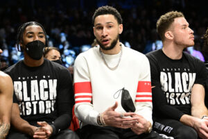 Ben Simmons of the Brooklyn Nets looks on from the bench during the first half against the Sacramento Kings at Barclays Center on February 14, 2022 in New York City. 