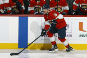 Sam Reinhart #13 of the Florida Panthers carries the puck up ice against the Nashville Predators at the FLA Live Arena on February 22, 2022 in Sunrise, Florida. The Predators defeated the Panthers 6-4.