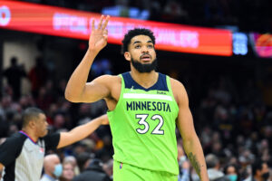 Karl-Anthony Towns #32 of the Minnesota Timberwolves celebrates after scoring during the fourth quarter against the Cleveland Cavaliers at Rocket Mortgage Fieldhouse on February 28, 2022 in Cleveland, Ohio. The Timberwolves defeated the Cavaliers 127-122.