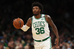 Marcus Smart #36 of the Boston Celtics dribbles the ball during the first quarter in the game against the Memphis Grizzlies at TD Garden on March 03, 2022 in Boston, Massachusetts.