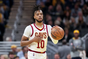 Darius Garland #10 of the Cleveland Cavaliers dribbles the ball in the first quarter against the Indiana Pacers at Gainbridge Fieldhouse on March 08, 2022 in Indianapolis, Indiana. 