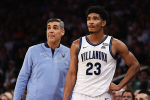 Head coach Jay Wright and Jermaine Samuels #23 of the Villanova Wildcats look on in the second half against the St. John's Red Storm during the 2022 Big East Tournament at Madison Square Garden on March 10, 2022 in New York City.