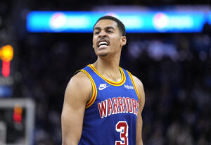 Jordan Poole #3 of the Golden State Warriors reacts after making a three-point shot against the Milwaukee Bucks in the second half of an NBA basketball game at Chase Center on March 12, 2022 in San Francisco, California.