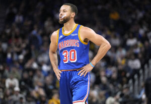 Stephen Curry #30 of the Golden State Warriors looks on against the Milwaukee Bucks in the second half of an NBA basketball game at Chase Center on March 12, 2022 in San Francisco, California.