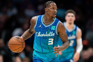 Terry Rozier #3 of the Charlotte Hornets brings the ball up court against the Dallas Mavericks during their game at Spectrum Center on March 19, 2022 in Charlotte, North Carolina.