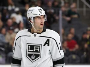  Phillip Danault #24 of the Los Angeles Kings waits for a faceoff in the second period of a game against the Vegas Golden Knights at T-Mobile Arena on March 19, 2022 in Las Vegas, Nevada