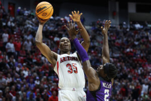 Christian Koloko #35 of the Arizona Wildcats shoots the ball against Emanuel Miller #2 of the TCU Horned Frogs during the second half in the second round game of the 2022 NCAA Men's Basketball Tournament at Viejas Arena at San Diego State University on March 20, 2022 in San Diego, California.