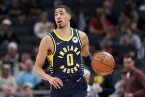 Tyrese Haliburton #0 of the Indiana Pacers dribbles the ball in the first quarter against the Denver Nuggets at Gainbridge Fieldhouse on March 30, 2022